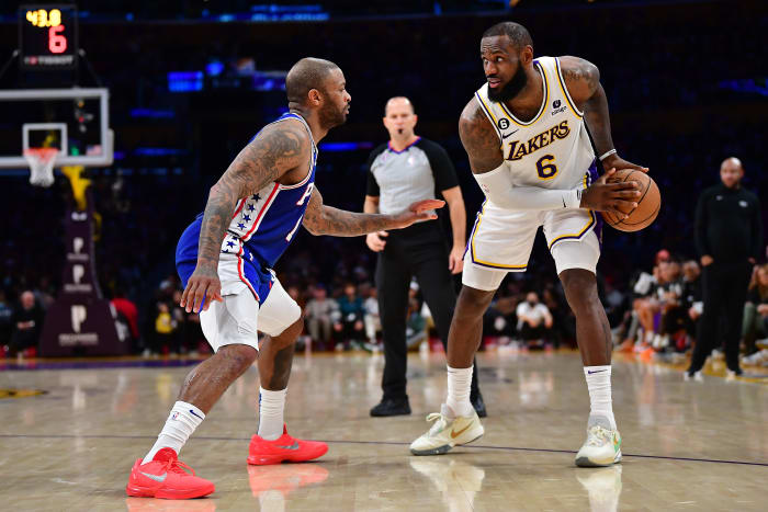 76ers forward P.J. Tucker defends Lakers forward LeBron James.